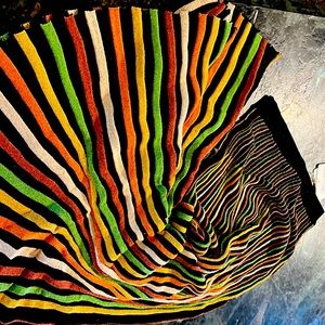 Is a soft stretch fabric , long skirt.  Very unique with colors & soft shimmer.